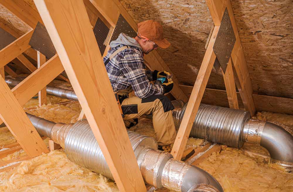 HVAC unit in attic with insulation